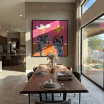 Neon Cowboys Share Silence - neon seated cowboys painting by Ethan Mercer, contemporary Western square wall art – styled room scene view 3